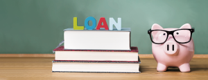 Using ROBS as an SBA loan down payment - Image showing a piggy bank wearing glasses next to a pile of books with the word "Loan" on the top.