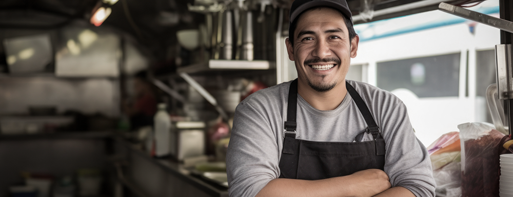 Happy food truck business owner. (Start a Food Truck Business: The Ultimate Guide - Guidant Blog).