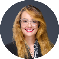 Image of Meghan Mitchell, an Account Manager at Guidant Financial with red hair and an expert smile.