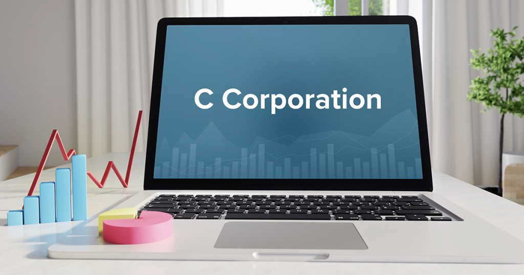 Computer showing "C Corporation" on the screen, imagery of converting C Corp to S Corp