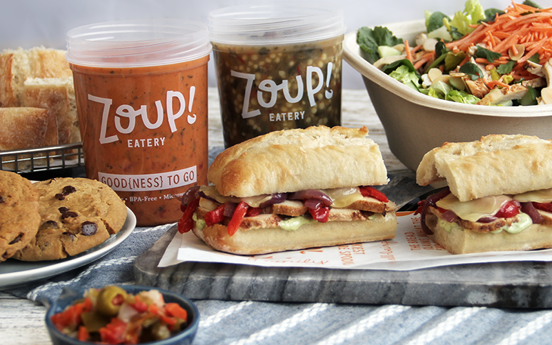 Zoup! Eatery soups, sandwiches, salads, and other foods on display with the Zoup! branding. Zoup is a healthy food franchise that focuses on serving soup and other tasty dishes.