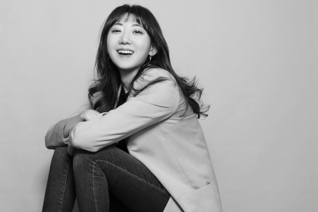 Portrait of woman entrepreneur and business owner, Esther Jh Kim. (5 Women Entrepreneurs Making an Impact - Guidant Blog.)