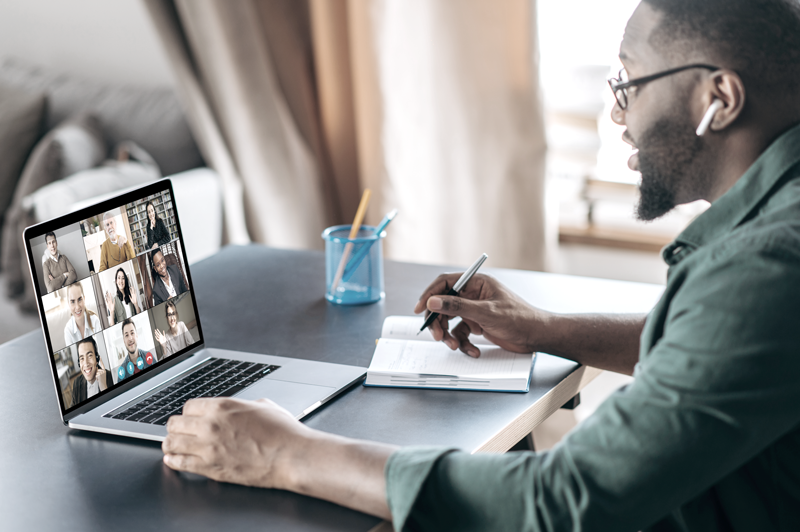 Man working on laptop on a Zoom call meeting (Top Remote Work Tips for Staying Connected and Efficient — Guidant Blog.)