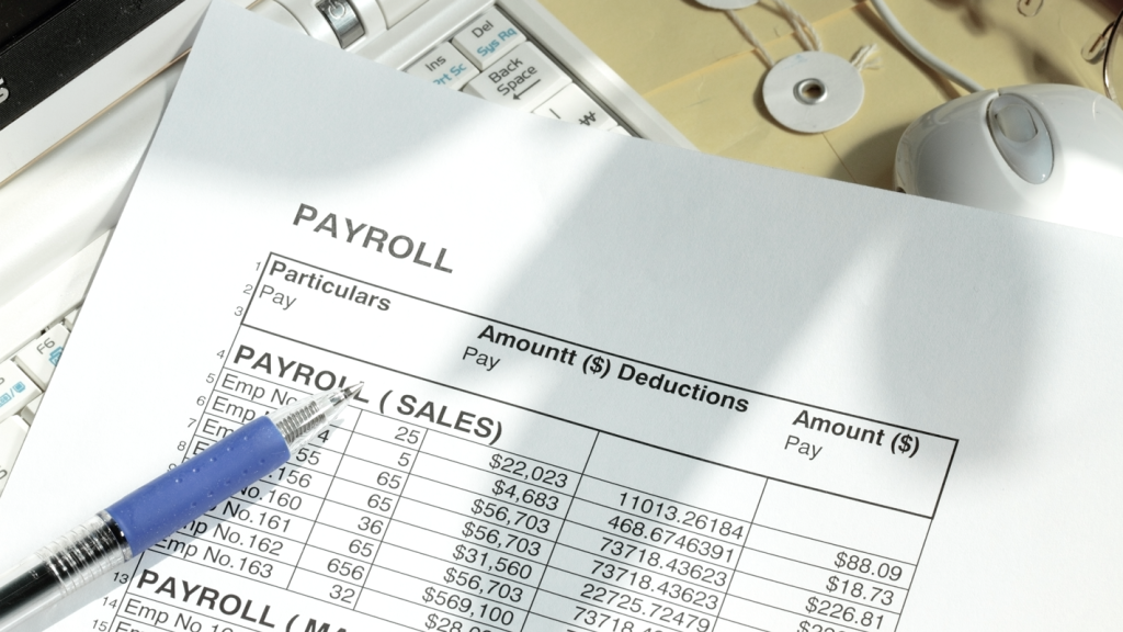 Image of payroll records paperwork. (Complete Guide to Payroll for Small Businesses - Guidant Financial.)