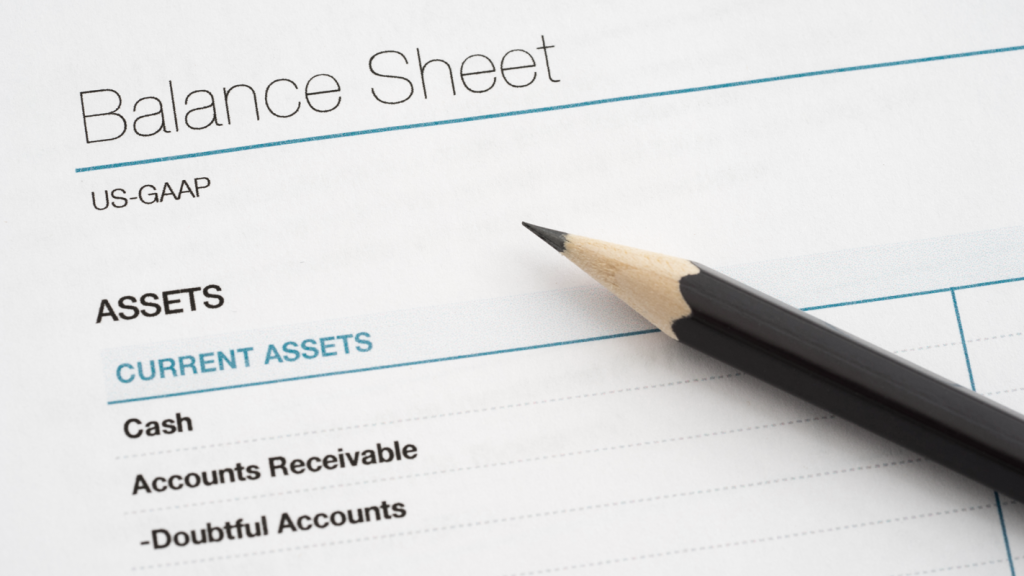 Paper reading "Balance Sheet." (Complete Guide to Bookkeeping - Guidant Financial).