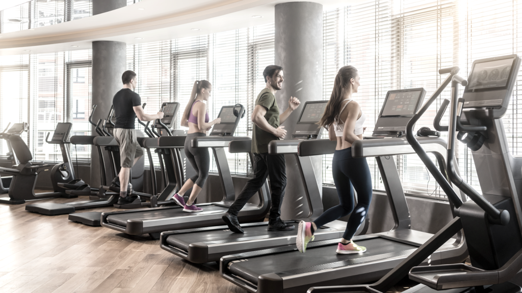 People working out on treadmills at a gym. (7 Creative Health and Wellness Business Ideas - Guidant Blog)