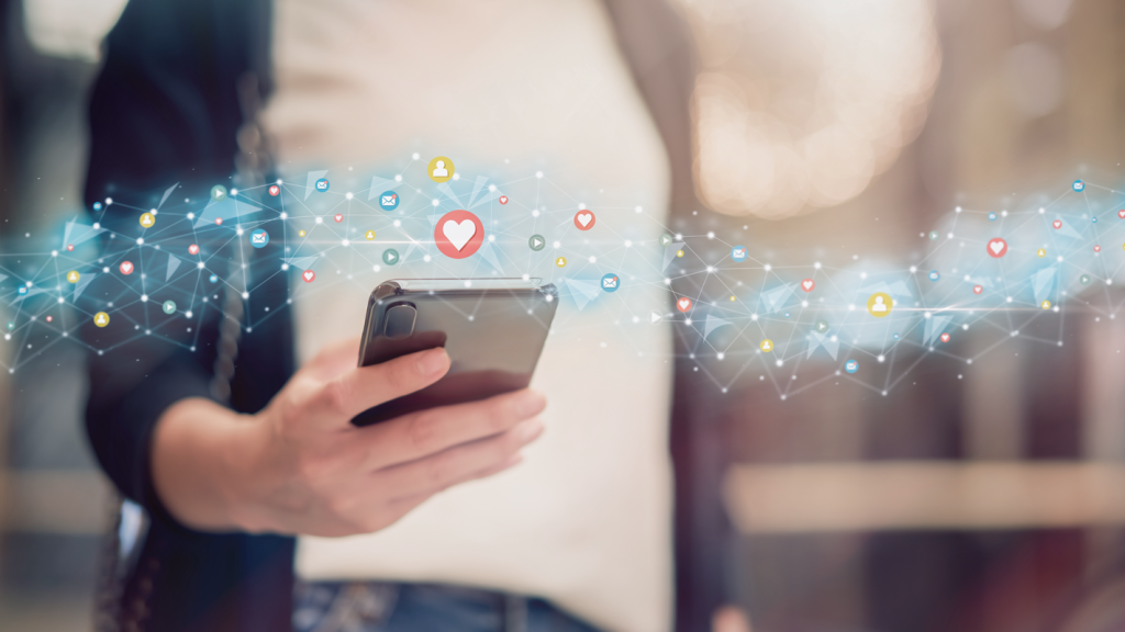 Person holding a phone with a social media graphic. (How to Start an Art Business: Complete Guide - Guidant Blog.)