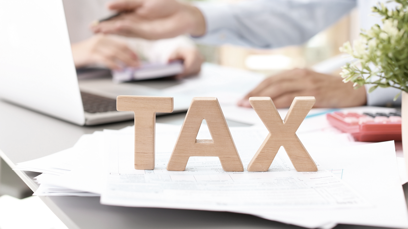 Tax blocks on paper stacks - Complete Guide to Taxes for Small Businesses